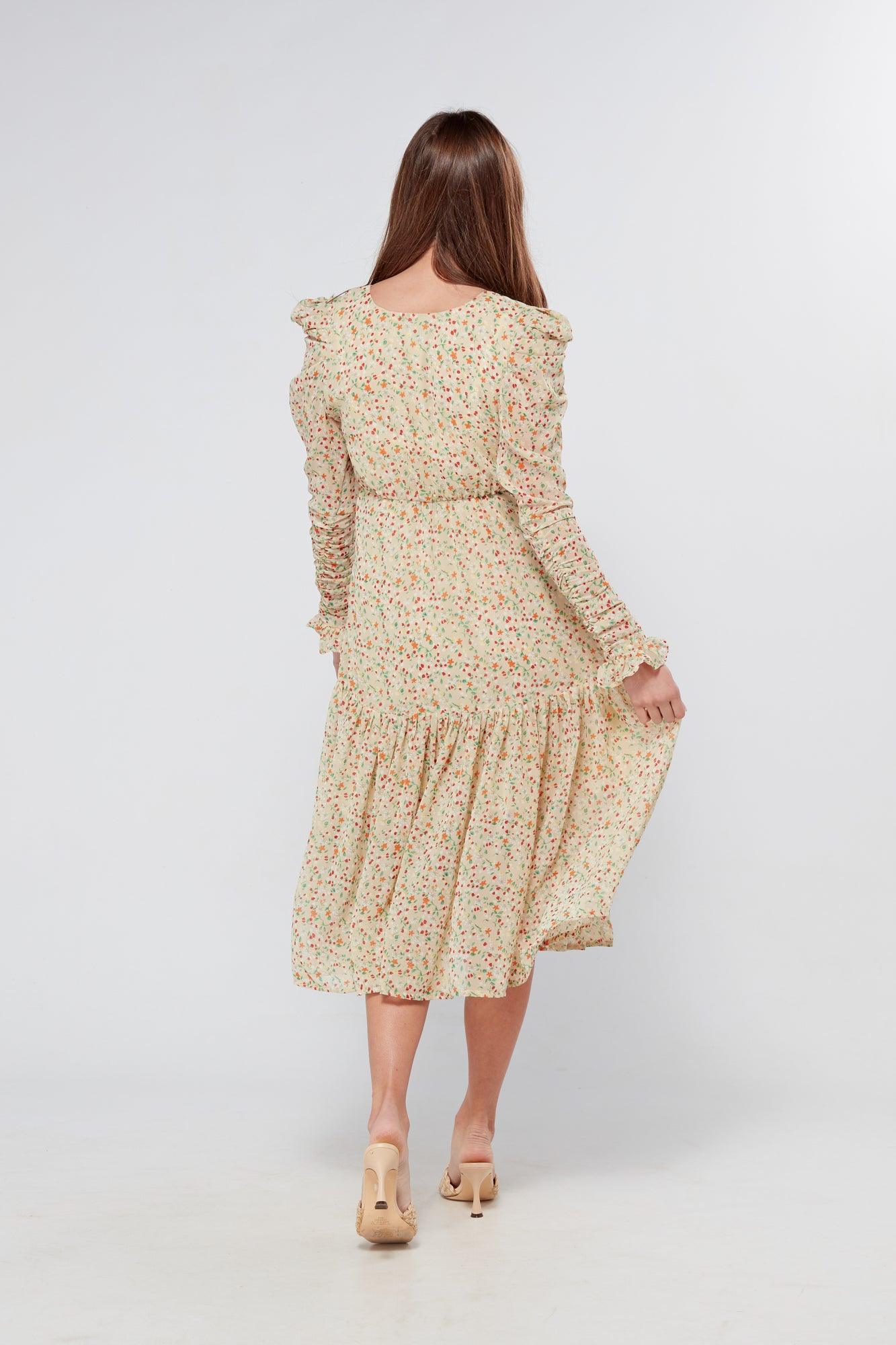Introducing our Georgette beige floral midi dress, the perfect addition to your wardrobe for any special occasion. The dress features a stunning floral print on a beige georgette fabric that flows beautifully into a big frill. The design is nicely fitted on the waist and hips, creating a flattering silhouette, and then flowing into a frill for a feminine touch.