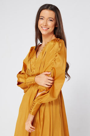 Goldyna Warm Gold Satin Maxi Dress With Buttoned Design Long Sleeves - TAHLIRA
